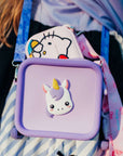 Purple silicone bag with a unicorn design and a pink Hello Kitty bag.