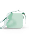 Green silicone camera bag with a patterned strap.