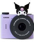 Front view of the Kidamento Model A Kuromi camera, featuring a playful Kuromi figure on top of the black lens, set against a clean white background