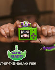 Rear view of the digital Buzz Lightyear mini camera showing the digital LCD screen, a purple circular directional pad, green buttons for navigation, themed filters and the selfie of a happy kid.