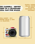 Digital Jessie mini camera mini camera with iconic wings shown next to a soda can for size comparison.