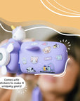 Close-up of Kidamento Model V unicorn kids digital camera decorated with fun stickers. Showcases the airplane-shaped design and customization options—perfect for creative kids ages 3 to 9.