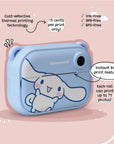 Angled view of the kiimento Model P Cinnamoroll kids’ digital camera on a pink background, highlighting the instant black-and-white print feature, cost-effective thermal printing (~5 cents per print), and eco-friendly qualities: ink-free, BPA-free, and BPS-free.