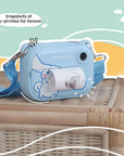 kiimento Model P Cinnamoroll kids’ digital camera placed on a wicker table, actively printing a black-and-white photo. The scene is framed by a colorful illustrated background with the caption “Snapshots of joy—printed for forever.”