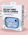 Product packaging of the Kidamento Model P Cinnamoroll instant print digital camera, showcasing the blue Cinnamoroll-themed camera inside a white gift-ready box with bold text and soft pink background. Tagline reads: “Joy in every box. Memories in every click!”