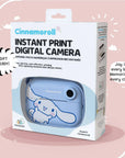 Product packaging of the kiimento Model P Cinnamoroll instant print digital camera, showcasing the blue Cinnamoroll-themed camera inside a white gift-ready box with bold text and soft pink background. Tagline reads: “Joy in every box. Memories in every click!”