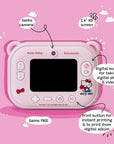 Back view of the kiimento Hello Kitty Model P digital camera for kids, showcasing a 2.4-inch IPS screen, selfie camera, and clearly labeled buttons. Features include a digital shutter button for photo and video capture, a print button for instant printing and album reprints, and Hello Kitty-themed decorations on a pastel pink camera body.