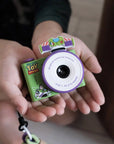 Hands holding kiimento Disney Buzz Lightyear Mini Camera Model A – green Toy Story Buzz mini kids camera