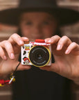 Hands holding kiimento Disney Jessie Mini Camera Model A – Toy Story Jessie cow print mini kids camera