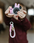 Girl holding kiimento Disney Minnie Mouse Mini Camera Model A – pink Minnie Mouse mini camera for kids