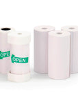 Five rolls of white thermal paper for the Model P camera, including two with green open stickers.