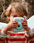 Mint Print Pro Camera held by a child.