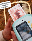 Mint Print Pro Camera printing a photo of someone taking a picture.