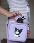 Child holding kiimento Sanrio Kuromi Mini Camera Model A and Kuromi Camera Bag – matching Sanrio gift set