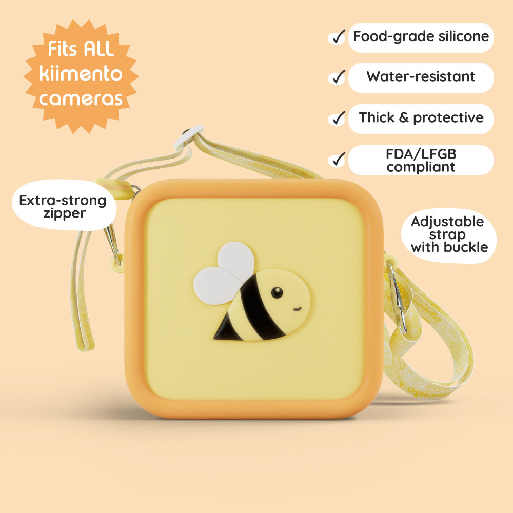 Yellow silicone bag with a bee design and adjustable strap.