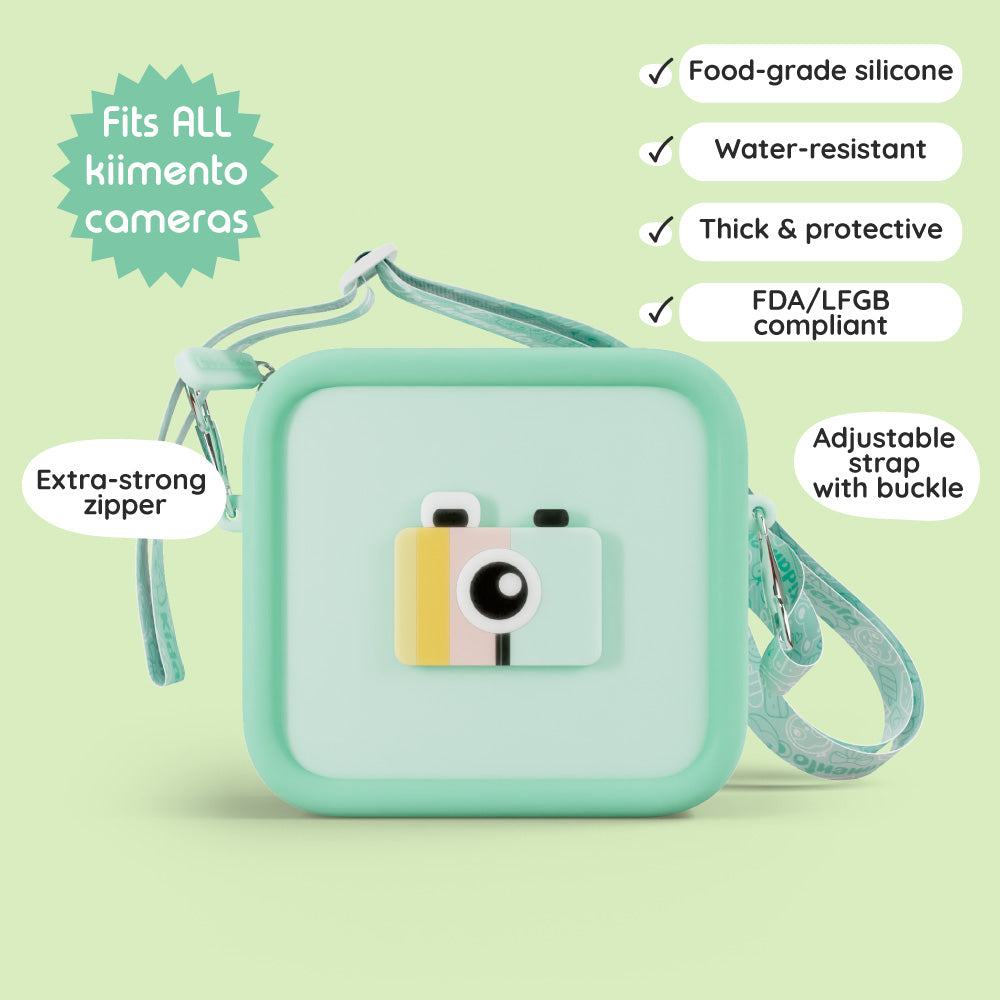 A green silicone camera bag with a camera design and adjustable strap.