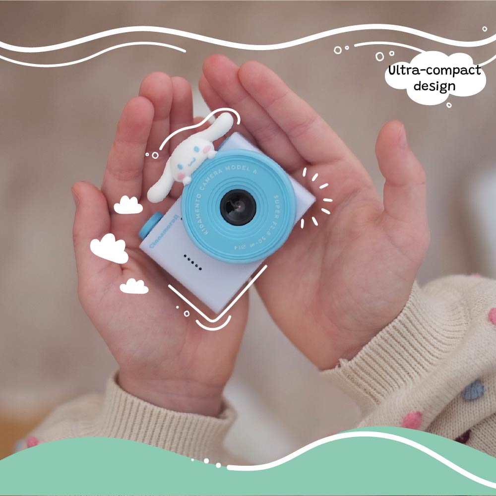 Child holding the Kidamento Model A Cinnamoroll kids&#39; digital camera in both hands, showing its ultra-compact design.