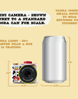 Digital Jessie mini camera mini camera with iconic wings shown next to a soda can for size comparison.
