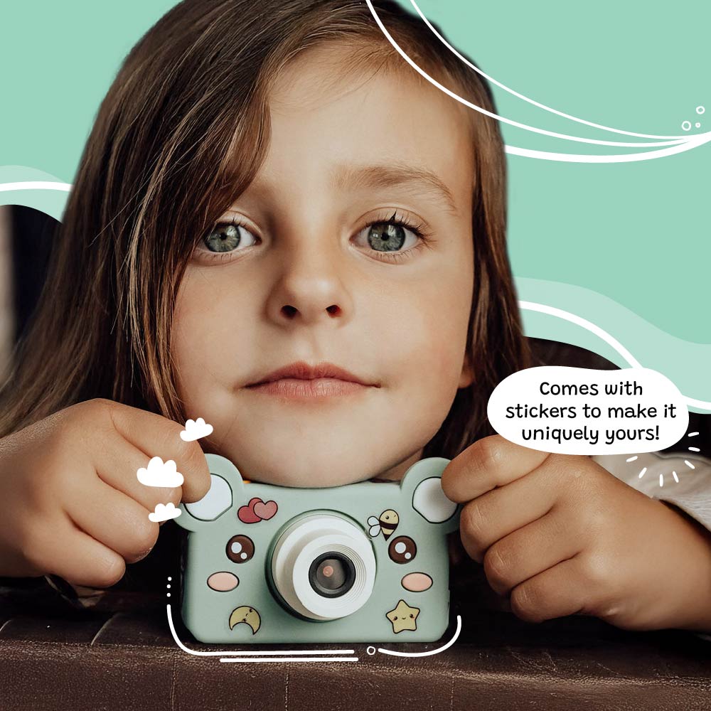 Young girl holding Kidamento Model C Bear kids digital camera customized with fun stickers.