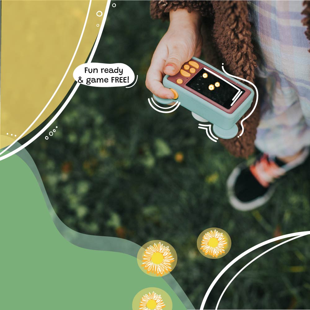 Kid holding Kidamento Model C Bear digital camera in hand, game-free and designed for fun photo play.