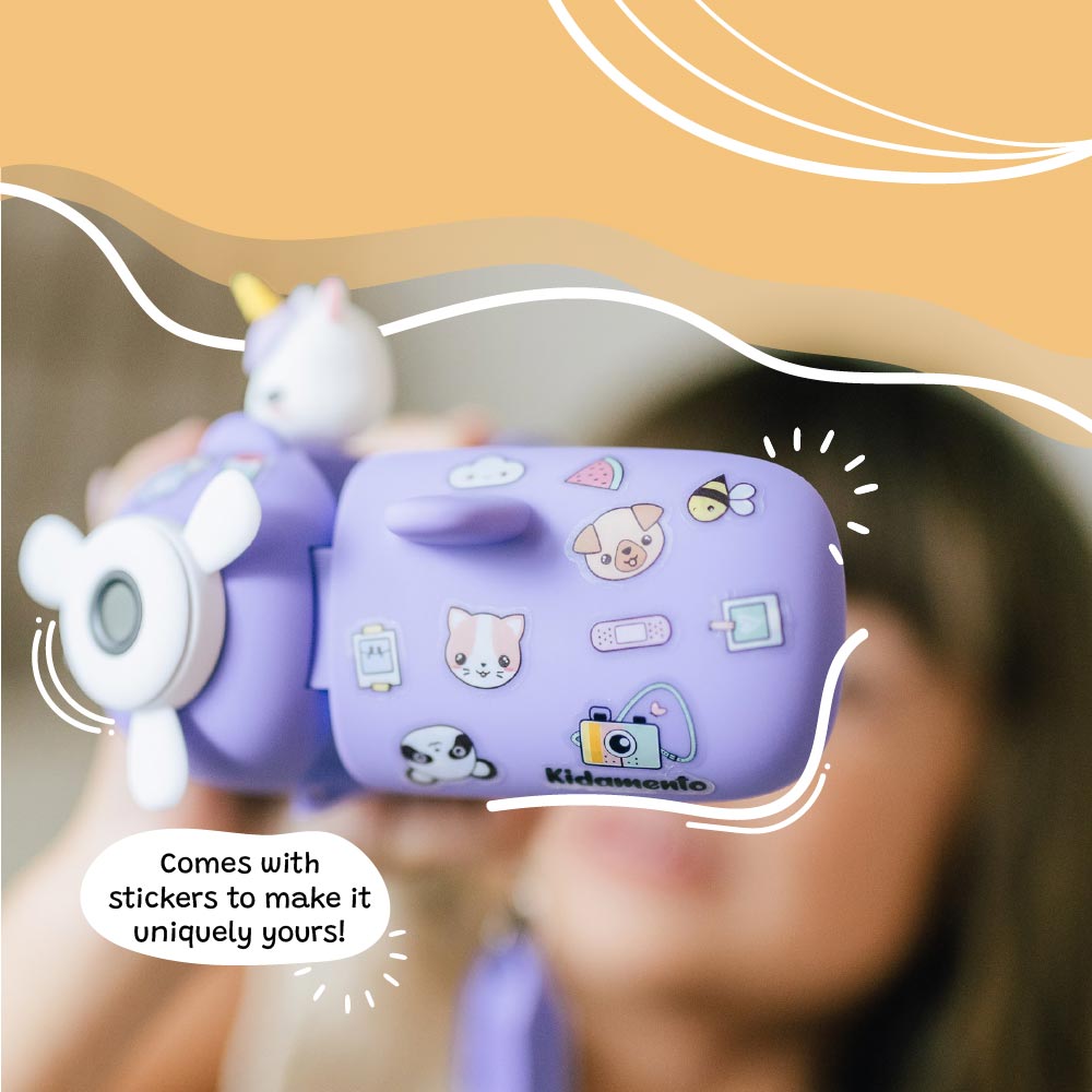 Close-up of Kidamento Model V unicorn kids digital camera decorated with fun stickers. Showcases the airplane-shaped design and customization options—perfect for creative kids ages 3 to 9.
