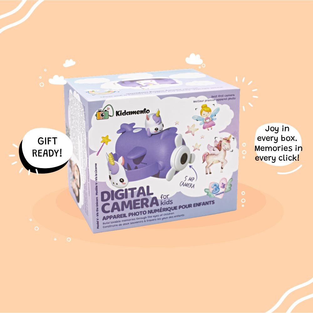 Retail packaging of Kidamento Model V unicorn kids digital camera. Gift-ready box features playful unicorn airplane design and highlights 5MP camera, selfie mode, and screen-free fun for ages 3 to 9.