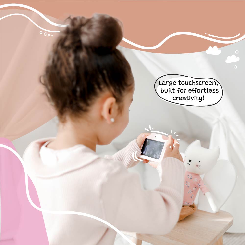 Young girl using the Kidamento Meowie the Cat digital camera with a large touchscreen, capturing creative photos indoors with her toy.