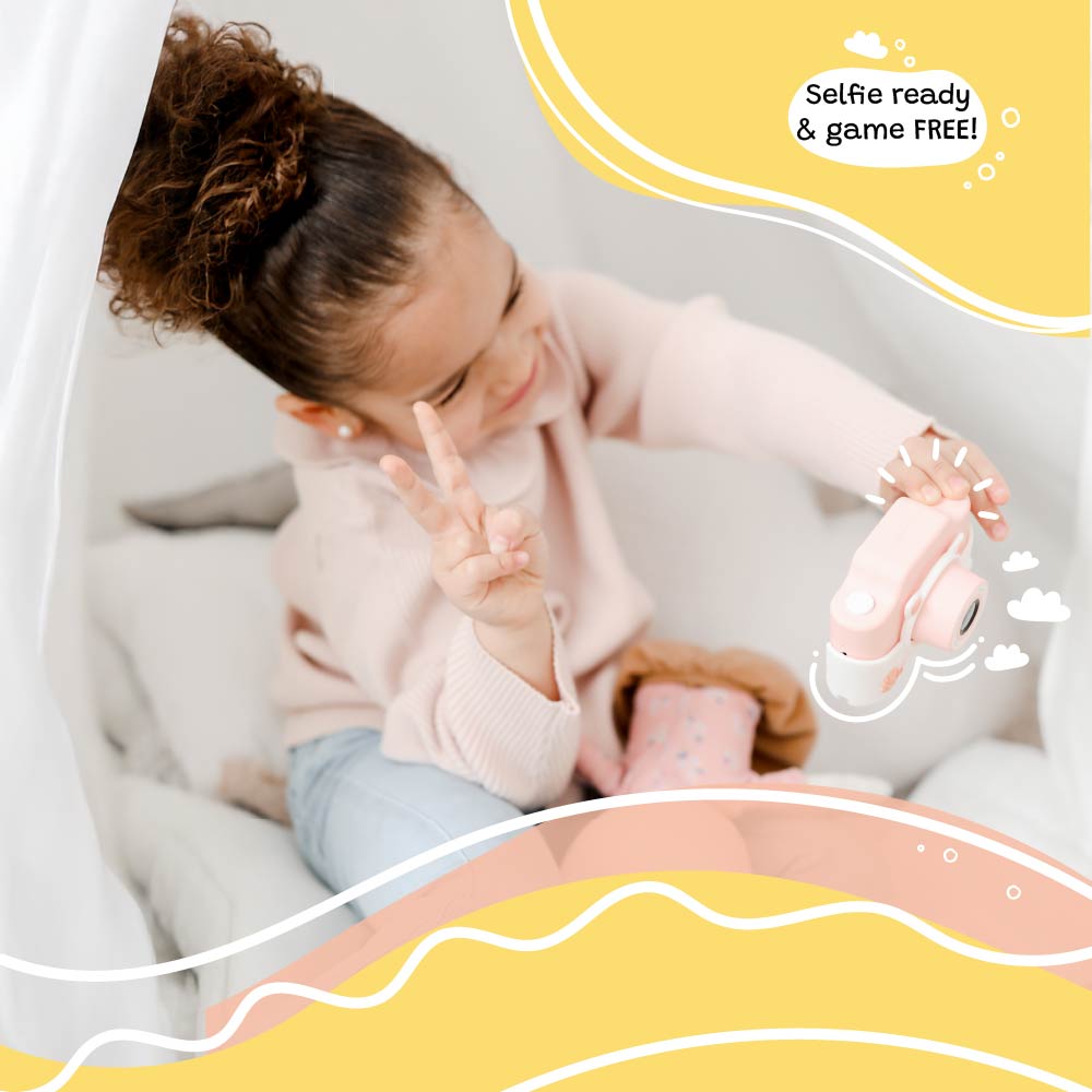 Girl taking a selfie with the Kidamento Meowie the Cat digital camera, showing its pink silicone design, game-free feature, and easy-to-use controls.