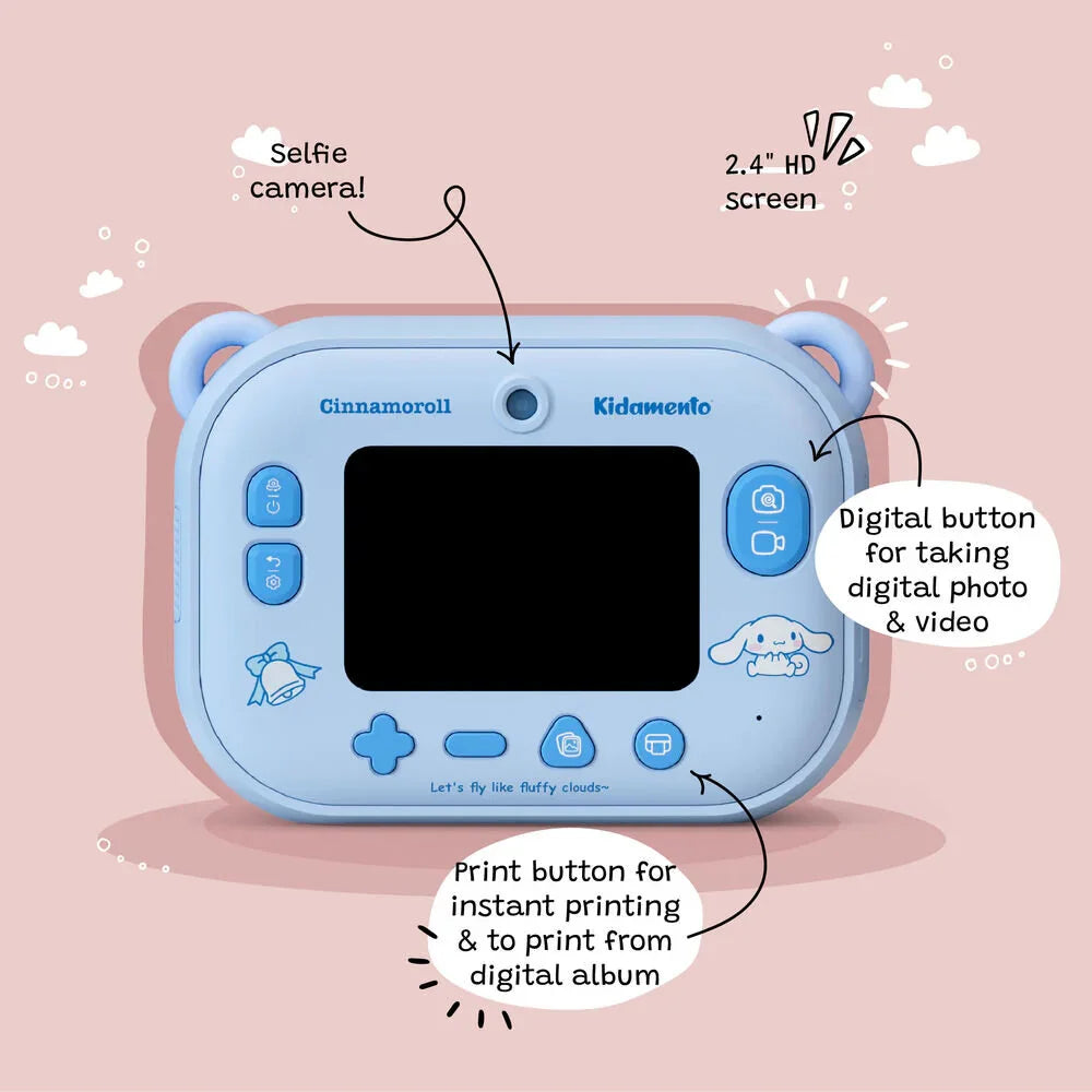 Back view of the Kidamento Model P Cinnamoroll kids’ digital camera showing labeled features including the selfie camera, 2.4-inch IPS screen, digital photo/video button, and print button for instant prints or printing from the digital album. Background is pink with playful cloud illustrations.