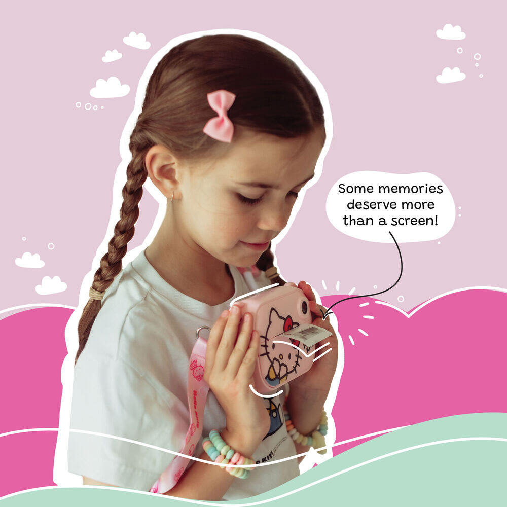 Young girl using the Kidamento Hello Kitty Model P kids digital camera to print a photo. The child, wearing pastel accessories and a pink bow, holds the camera close while a black-and-white photo prints out. The background features whimsical clouds and hills, with a caption that reads, “Some memories deserve more than a screen!”