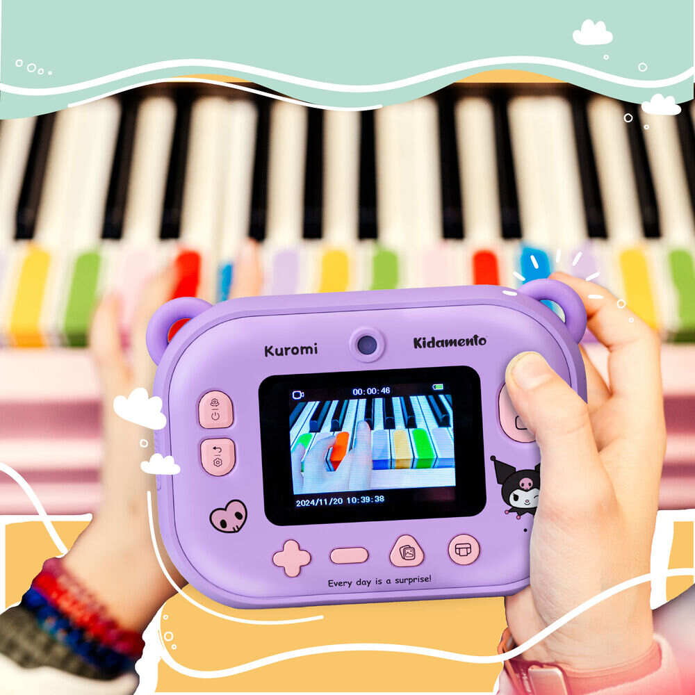 Kids digital camera Model P Kuromi Kidamento – lifestyle shot of a child holding the camera while playing colorful piano keys