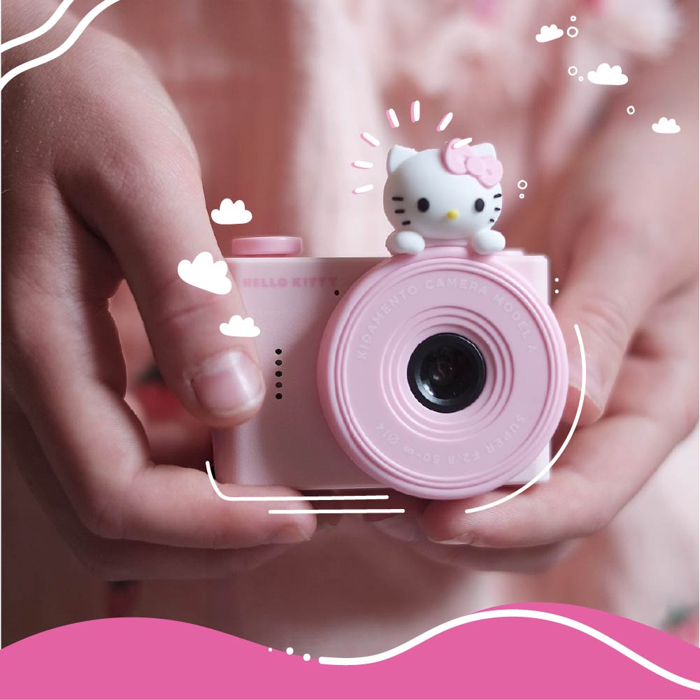 Hello Kitty Model A Kids Digital Camera - Close-up of Child Holding Camera, Compact Design Perfect for Little Hands.