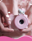 Hello Kitty Model A Kids Digital Camera - Close-up of Child Holding Camera, Compact Design Perfect for Little Hands.