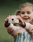 Girl using kiimento Cat Digital Camera Model K outdoors – pink silicone cat-design kids touchscreen camera
