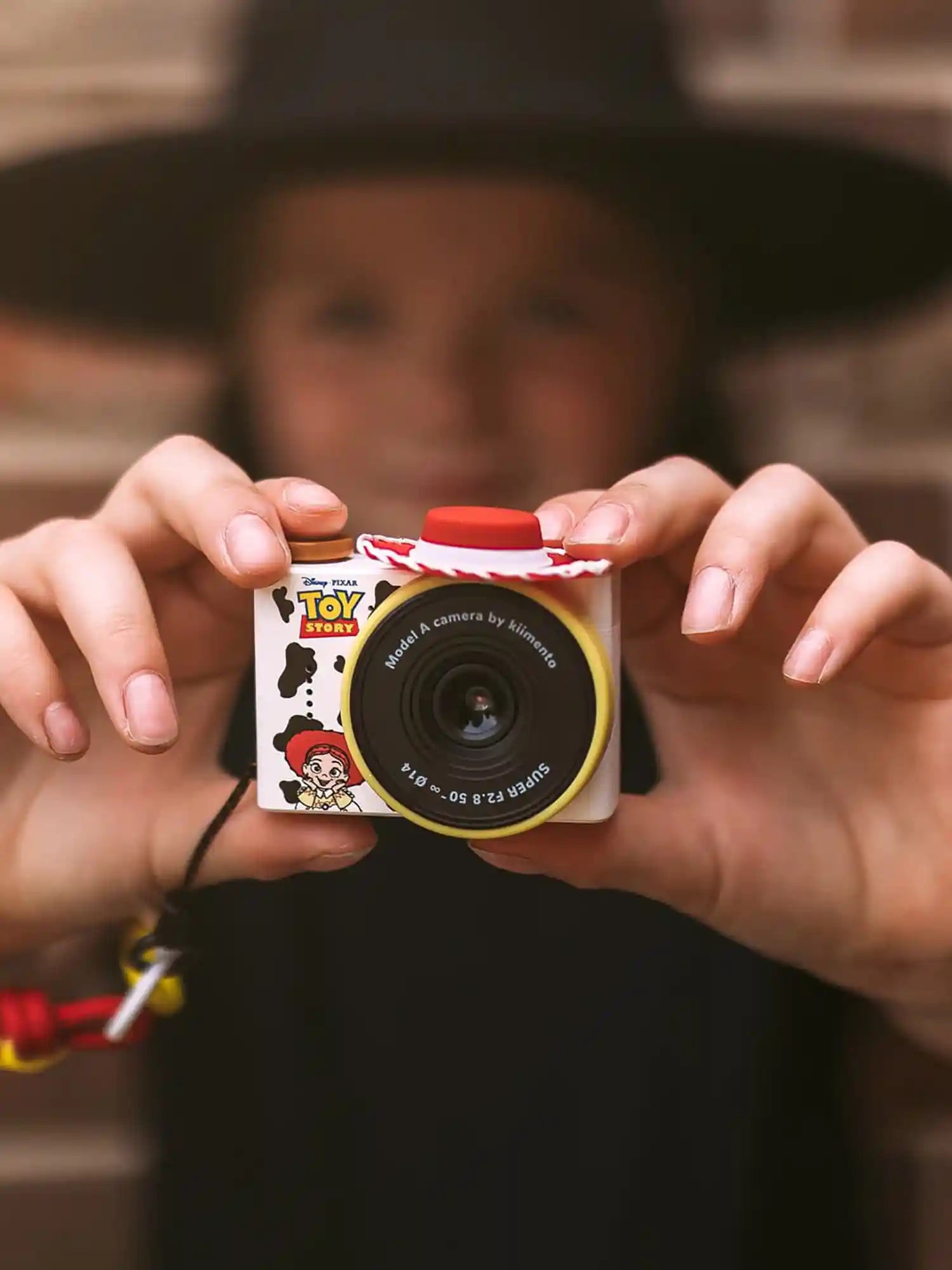 Hands holding kiimento Disney Jessie Mini Camera Model A – Toy Story Jessie mini kids camera
