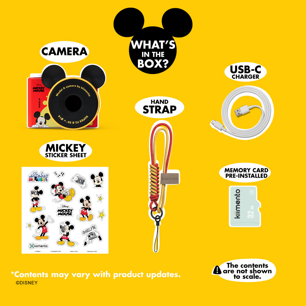 Mickey Mouse mini camera with accessories including a sticker sheet, hand strap, USB-C charger, and memory card.