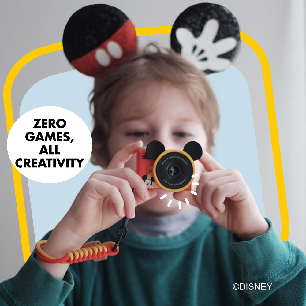 Mickey Mouse mini camera with Mickey ears and a yellow and red wrist strap.