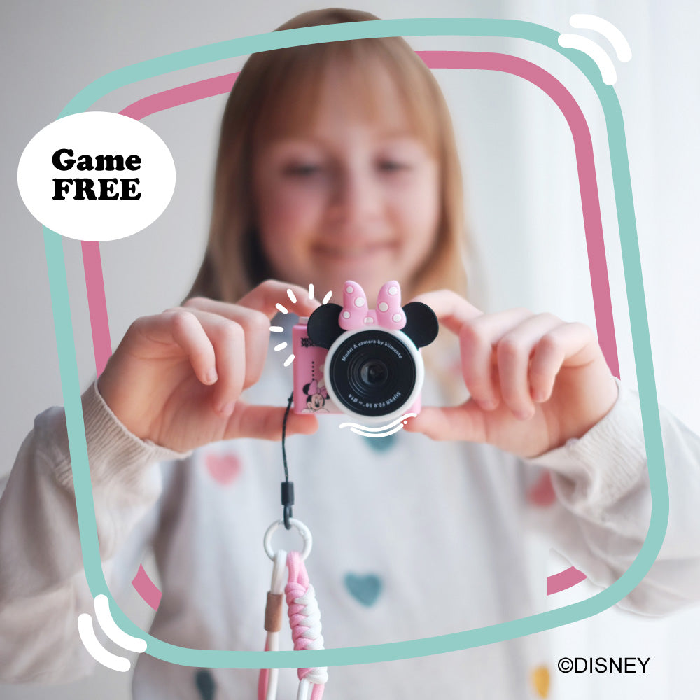 Minnie Mouse mini camera with pink bow and ears holding by a girl.