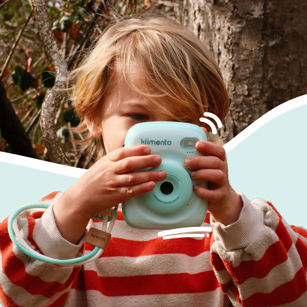 Mint Print Pro Camera held by a child.
