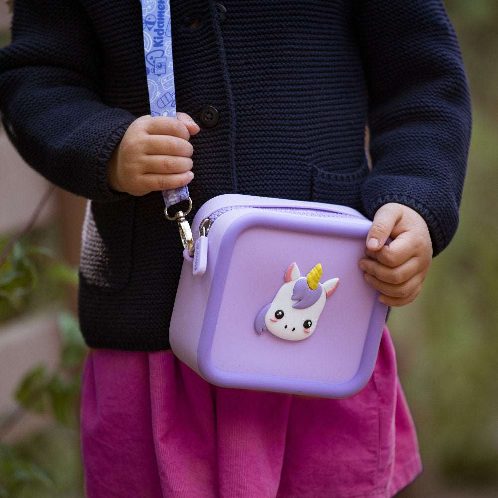 Purple silicone bag with a unicorn design and a patterned strap.