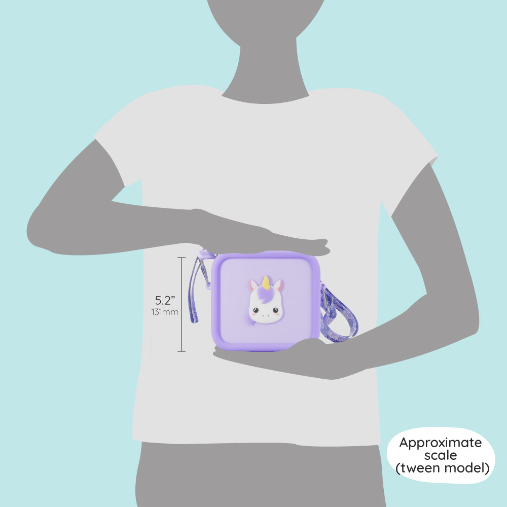 A tween model holds a purple unicorn silicone bag measuring 5.2 inches in height.