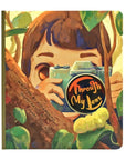 An activity book titled "Through My Lens" features a child holding a camera.